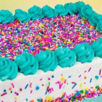 Celebration Cake(Family Size Round) · Serves 10- 13. Vanilla frozen yogurt on a Chocolate cake. 
Image reflects decoration style o...