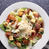 Caesar Salad · Chopped romaine and tomato, bacon, croutons, Parmesan cheese, Caesar dressing recommended on...