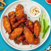 Classic Chomp Wings  · Fresh chicken wings breaded and fried until golden brown. Served with your choice of dipping...