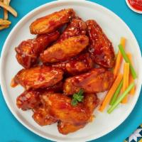 Hot Buffalo Wings  · Fresh chicken wings breaded, fried until golden brown, and tossed in buffalo sauce. Served w...