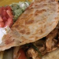 Big Quesadilla Hacienda · A flour tortilla stuffed with cheese, your choice of grilled chicken, or steak, grilled gree...