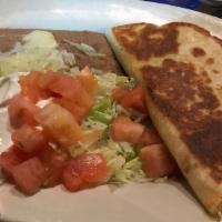 Quesadilla Rellena · Our cheese quesadilla stuffed with your choice of ground beef, shredded beef or shredded chi...
