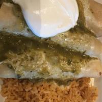 Enchiladas Verdes · Three grilled chicken enchiladas covered with cheese sauce, salsa verde and sour cream. Serv...