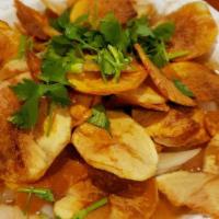 Potato Chip  · Thin sliced potatoes, onions and scallions tossed in a rich,
light brown gravy.