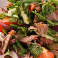 Beef Salad · Spicy. Grilled slices of beef mixed with Thai chili paste, tomatoes, fresh cucumber and onio...