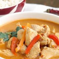 Red Curry · Spicy. Red curry paste cook with coconut milk and bamboo shoot with your choice of meat topp...