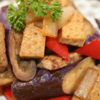 Eggplant Deluxe · Spicy. Eggplant and tofu with chili peppers jalapeno and basil. Served with small jasmine ri...