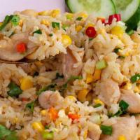 Thai Fried Rice · Stir fried rice with egg, carrot, onion and choice of meat topped with green onion.