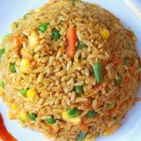 Curry Fried Rice · Stir fried rice with egg, curry powder, onion carrot topped with green onion and your choice...