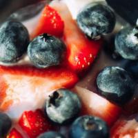 Yogurt Parfait · Low fat vanilla yogurt, blueberries, strawberries, raspberries, and coconut cluster granola