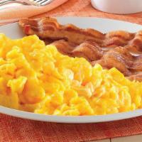 Two Egg Breakfast · Scrambled eggs served with your choice of bacon, sausage links, or sausage patties, and hash...