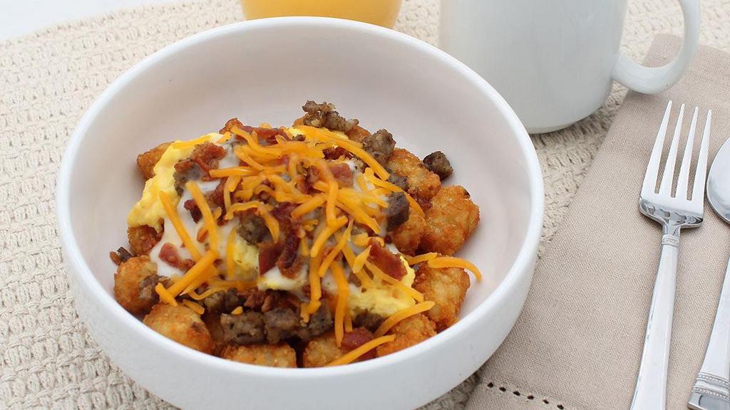 Sausage Breakfast Bowl · Scrambled eggs with sausage, gravy, cheddar cheese, and bacon bits served over your choice of grits, hash browns, or tater tots..