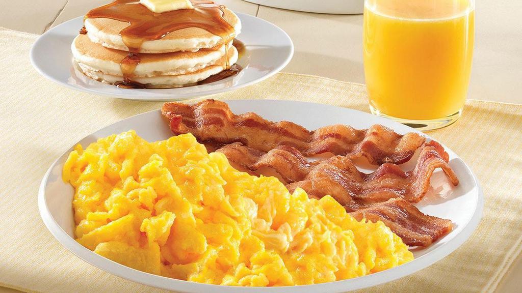 Classic Breakfast Combo · Scrambled eggs served with your choice of bacon, sausage links, or sausage patties, and two pancakes or one biscuit with gravy..