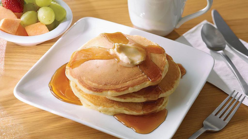 Pancakes · A short stack of 3 pancakes.