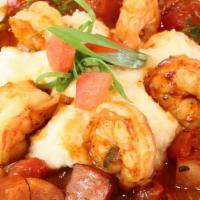 Shrimp And Grits  · Wild gulf shrimp, Andouille sausage, tomato fondue, Shagbark Mill white cheddar grits.