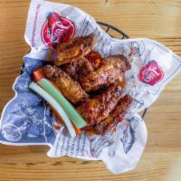 Chicken Wings · Cooked wing of a chicken coated in sauce or seasoning. extra sauce for an additional charge.