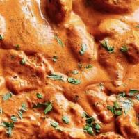 Butter Chicken · Boneless pieces of chicken cooked in a rich tomato sauce, sweetened by honey and topped with...