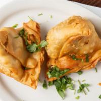 Samosa · Deep fried crispy pastry turnover filled with mashed potato & peas served with tamarind chut...