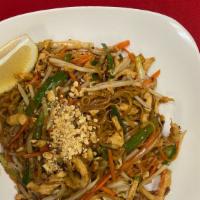 Pad Thai · Traditional rice noodles served with eggs, green onions, bean sprouts, carrots and crushed p...