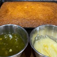 Skillet Corn Bread · Sweet honey butter and jalapeño jelly.