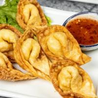 Crab Rangoon · Six pieces. Deep-fried blended crab, cream cheese and water chestnut wrapped with wonton skin.