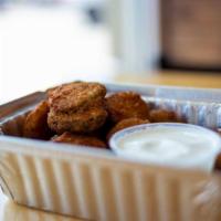 Fried Pickles · Hand battered pickle chips, fried to a crisp perfection.