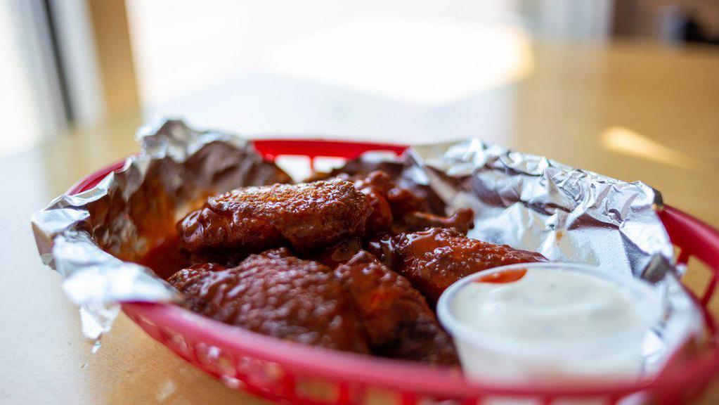 6 Traditional · 6 Bone-In wings tossed in your choice of Mild, Hot, Hot BBQ, Savory BBQ, Roasted garlic BBQ, Teriyaki, or Sweet Chili