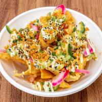 Poke Nachos · Pickled onion, jalapeno, pineapple salsa, and avocado served over a crispy bed of wontons. G...