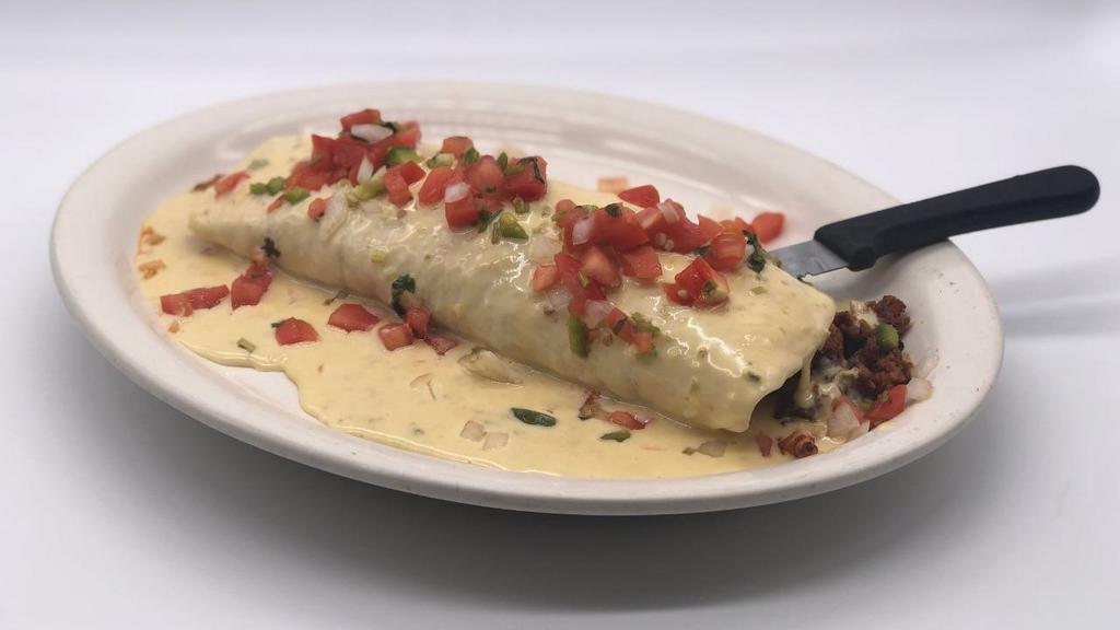Burrito San Jose · 1 huge burrito stuffed with grilled chicken, chorizo, rice and beans, topped with cheese sauce and pico de gallo.