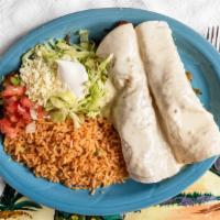 Burritos Fajitas · 2 burritos filled with choice of grilled steak or chicken, bell peppers, and tomatoes. Cover...