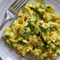 Huevos Revueltos · Scrambled eggs with rice and beans..