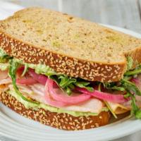 Turkey And Greens · Smoked turkey, arugula, a whipped feta dressing and pickled onions over Farm to Market Bread...
