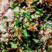 Puerco Verde · Pork shoulder (raised without antibiotics) cooked in a green chili sauce. Topped with cotija...