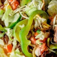 Steak Fajita · Marinated and grilled flank steak served with bell peppers and onions. Topped with pico, let...