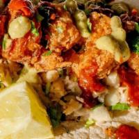 Crispy Shrimp · Crispy shrimp served over jalapeno slaw and topped with avocado crema, cilantro and a roaste...