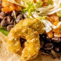 Rajas Taco · Bell peppers, cactus, poblano peppers and black bean puree topped with pico, lettuce  and sl...