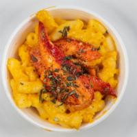 Lobster Mac N Cheese · Small 8oz cup of lobster mac n cheese and topped off with fresh herbs.