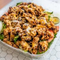 Grilled Chicken Salad · Marinated grilled chicken breast, lettuce, tomatoes, cucumbers, hard-boiled egg and mixed ch...