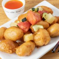Sweet And Sour Chicken · Deep fried jumbo chicken tenderloin with cucumber, tomato, and pineapple topped with our hom...