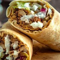 Chicken Shawarma Wrap · Chicken Shawarma in a Wrap with: lettuce, tomatoes, tabooleh, and pickles, topped with our s...