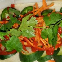 Banh Mi Vietnamese Dog · Start with placing an Angus Beef Dog on the bun then topped with fresh in house made pickled...