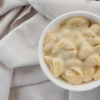 White Cheddar Mac N Cheese · We give you a a nice n creamy White cheddar Mac N Cheese in a 6 Oz. Portion.  This is the be...