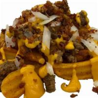 Bacon Cheeseburger Wedges · Baked, seasoned potato wedges topped with cheddar cheese sauce, seasoned ground beef, diced ...
