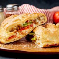 Supreme Calzone · Pepperoni, Sausage, Green Peppers, Onions, Mushrooms, and Cheese.