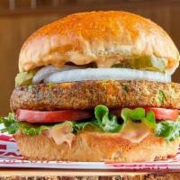 Veggie Garden Ranch · Veggie burger patty, lettuce, tomato, pickle, onion, and spicy garlic ranch sauce, served on...