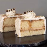 Tiramisu Cake Slice · White Cake, Soaked with Coffee Liquor and filled with Tiramisu Filling