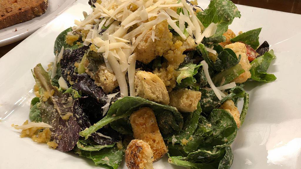 Entree Caesar Salad (Gf) · Romaine lettuce, cashew & caper Caesar dressing, garlic hemp-seed crumble, and grated fresh parm. Topped with house-made croutons, available gluten-free.