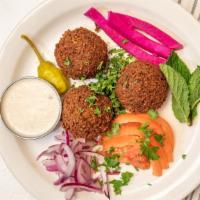 Falafel Appetizers · Vegetarian. Deep fried vegetable patties made of chick peas, fava beans, garlic, cumin, and ...