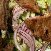 Gyro Salad · Gyro meat over lettuce, tomatoes, and cucumbers topped with house dressing, feta cheese, and...