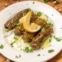 Grape Leaves Appetizers · Vegetarian. Rolled vine leaves stuffed with rice, tomatoes, crushed wheat, mint, parsley, on...